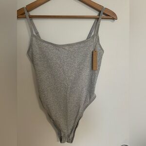 SKIMS cotton bodysuit with logo trim. NWT
